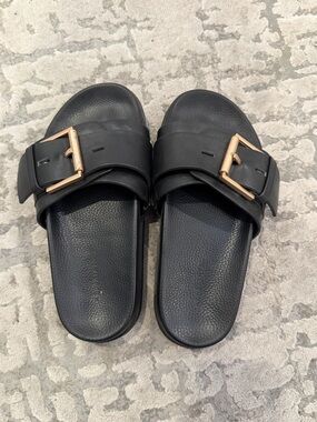 All Saints Black Slide Sandals with Gold Buckles